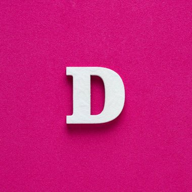 Letter D uppercase - White wood font on rhodamine red background