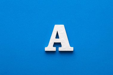Letter A uppercase - White wood font on blue foamy background
