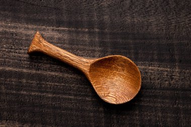 wooden spoon on dark rustic table - Kitchen accessory
