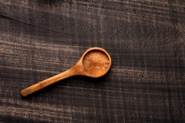 wooden spoon on dark rustic table - Kitchen accessory
