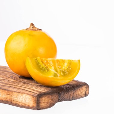 Solanum quitoense - Exotic naranjilla fruit isolated on white background
