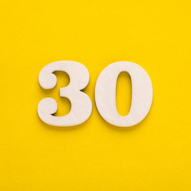 Number 30 on a yellow background - Two-digit number in white