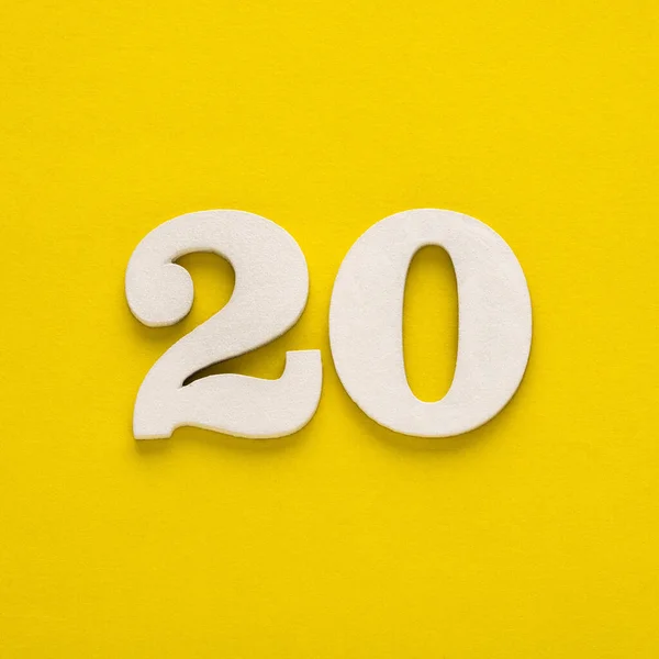 Number 20 on a yellow background - Two-digit number in white