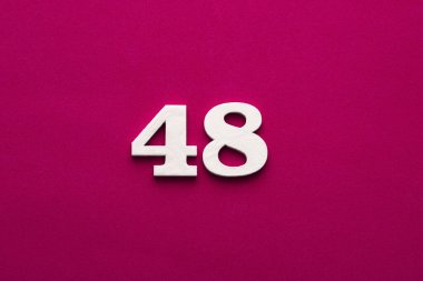 Number 48 - White wooden number on rhodamine red background