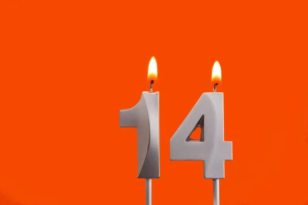 Candle number 14 - Birthday in orange background