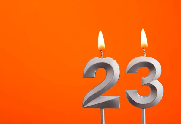 23号 橙色背景银婚蜡烛 — 图库照片