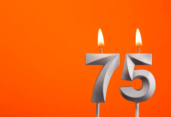 75号 橙色背景银婚蜡烛 — 图库照片
