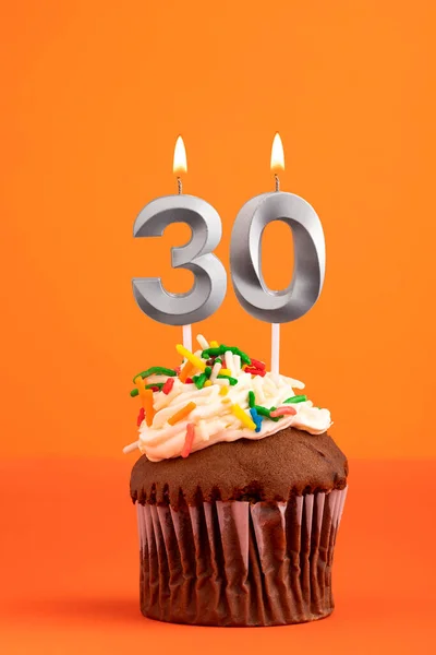 Birthday cake with candle number 30 - Orange foamy background