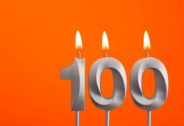 Свеча Номер 100 День Рождения Оранжевом Фоне — стоковое фото