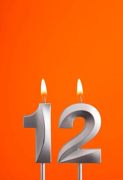 Свеча День Рождения Оранжевом Пенном Фоне — стоковое фото