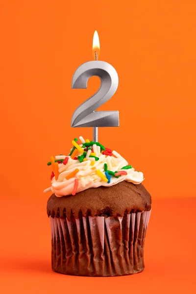 Birthday cake with candle number 2 - Orange foamy background