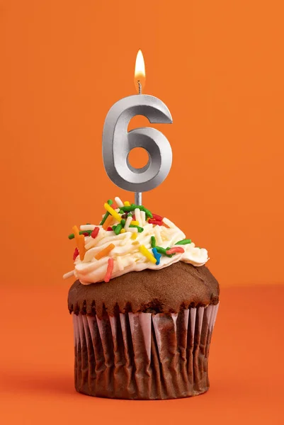 Birthday cake with candle number 6 - Orange foamy background