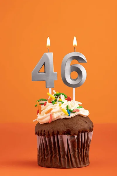 stock image Birthday cake with candle number 46 - Orange foamy background