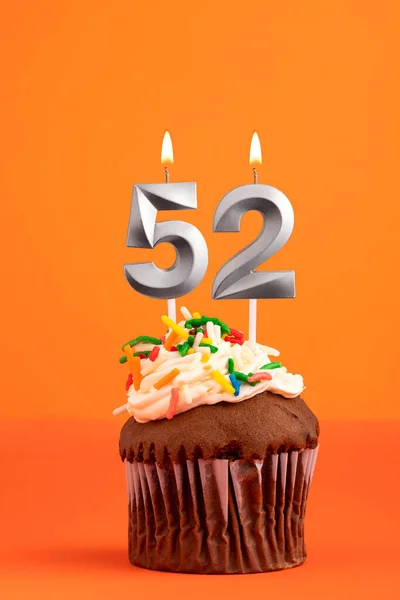 Birthday cake with candle number 52 - Orange foamy background