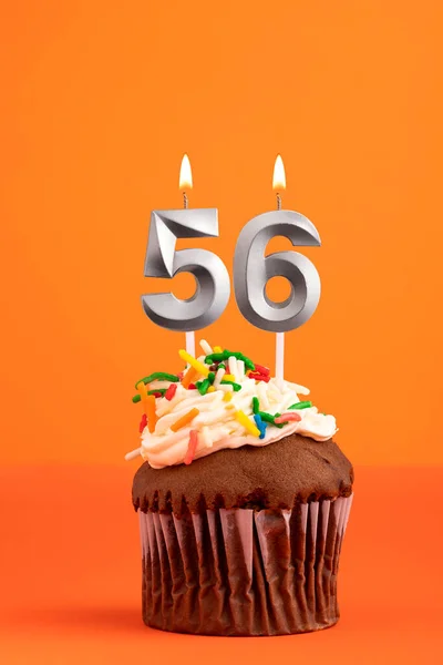 Birthday cake with candle number 56 - Orange foamy background