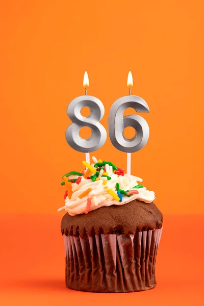 Birthday cake with candle number 86 - Orange foamy background