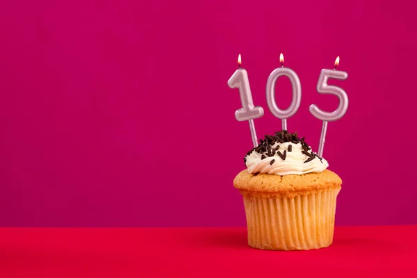 stock image Birthday cake with candle number 105 - Rhodamine Red foamy background