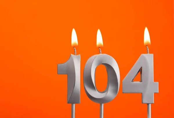 Svíčka Číslo 104 Narozeniny Oranžovém Pozadí — Stock fotografie