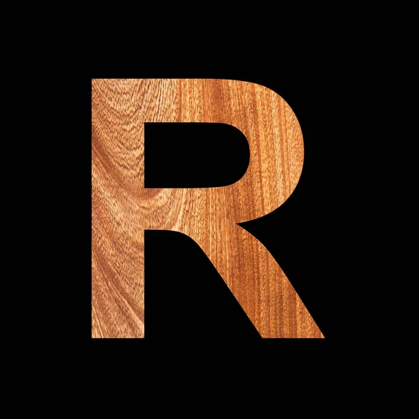 オーク材の背景に大文字のR ブラックの背景 — ストック写真