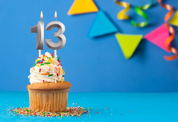 stock image Birthday cake with candle number 13 - Blue background