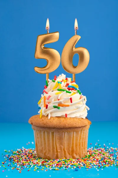 stock image Birthday cake with candle number 56 - Blue background