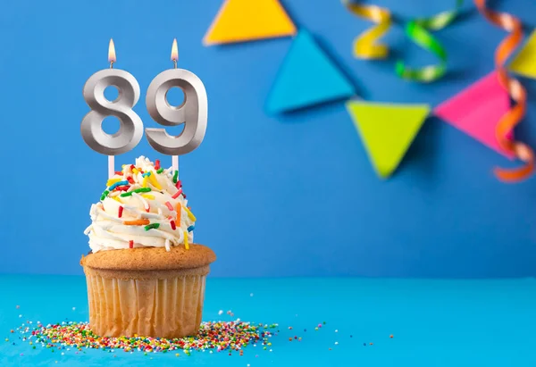 stock image Birthday cake with candle number 89 - Blue background