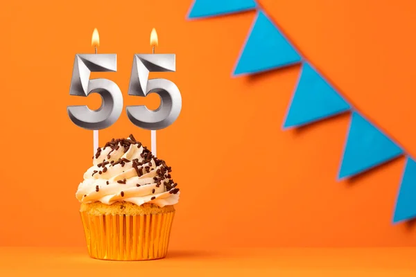 stock image Candle number 55 - Cake birthday in orange background