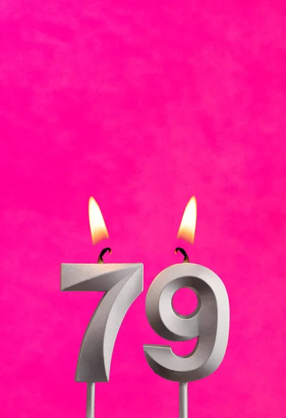 キャンドルナンバー79 フクシアの背景に誕生日のお祝い — ストック写真