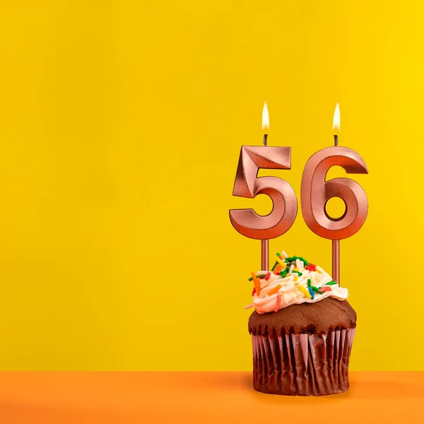 56岁生日蜡烛 黄色背景下的庆祝活动 — 图库照片