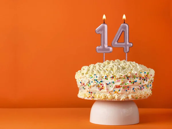 stock image Candle number 14 - Vanilla cake in orange background