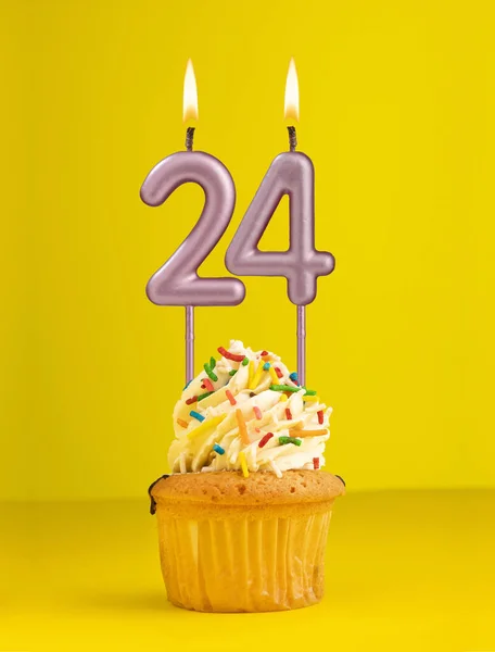 Number 24 candle - Birthday card design in yellow background