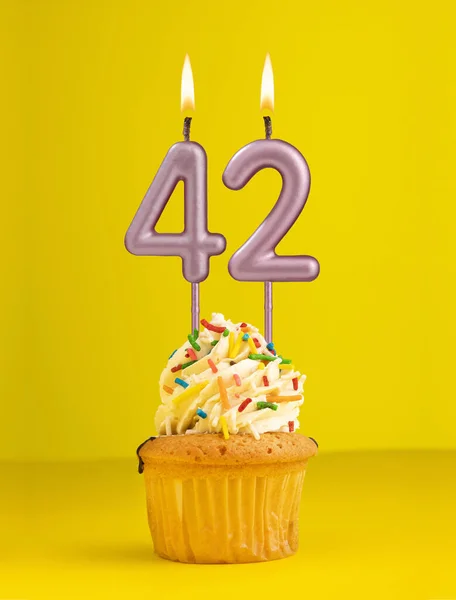 Number 42 candle - Birthday card design in yellow background