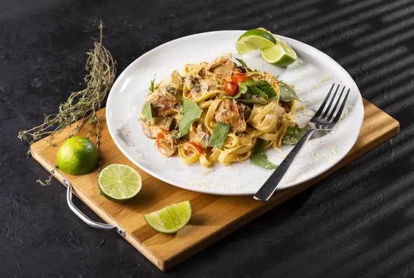 Pasta dish with smoked lemon chicken - Mushrooms, cherry tomatoes, garlic butter, parmesan and basil