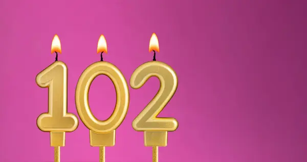 Birthday card with candle number 102 - purple background