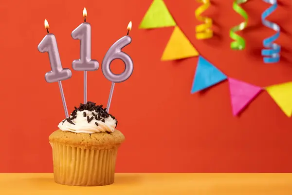 stock image Birthday cake with number 116 candle - Sparkling orange background with bunting