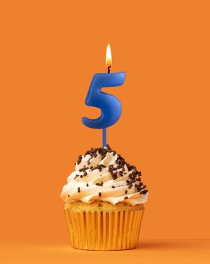 Blue candle number 5 - Birthday cupcake on orange background clipart