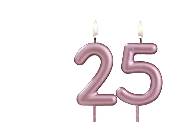 Candle number 25 - Lit birthday candle on white background