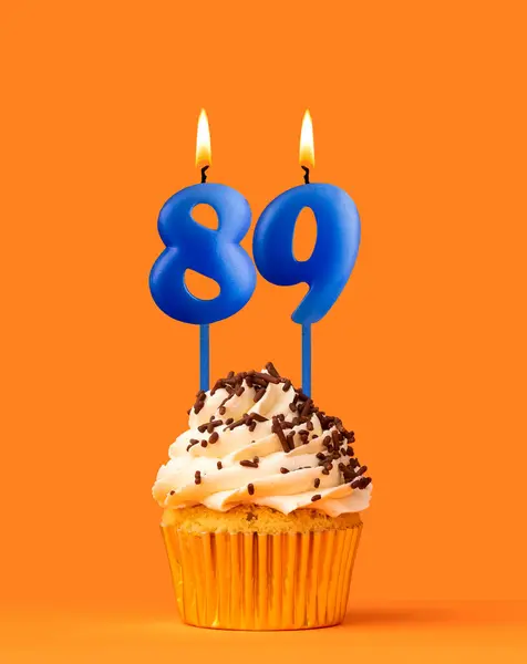 Blue Candle Number Birthday Cupcake Orange Background — Stock Photo, Image