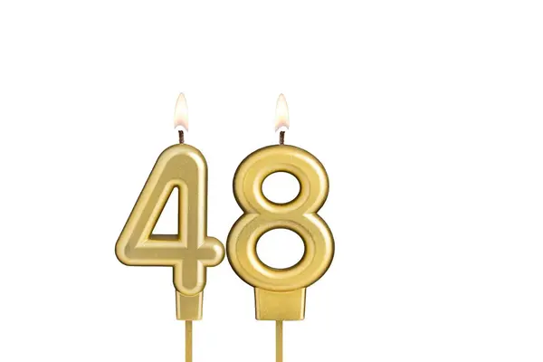 stock image Golden number 48 birthday candle on white background