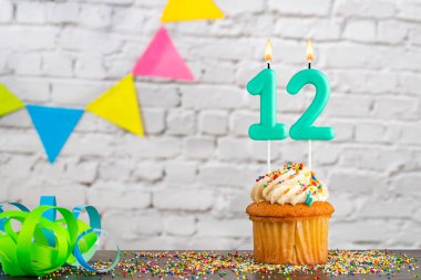 Green birthday candle - Candle number 12 clipart