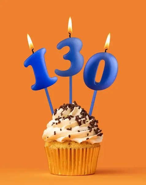 stock image Blue birthday candle and cupcake - Number 130