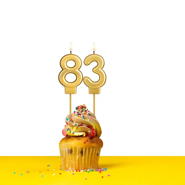 stock image Cupcake with birthday candle - Candle number 83