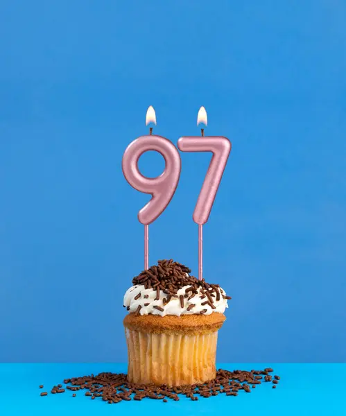 stock image Birthday candle with cupcake on blue background - Number 97