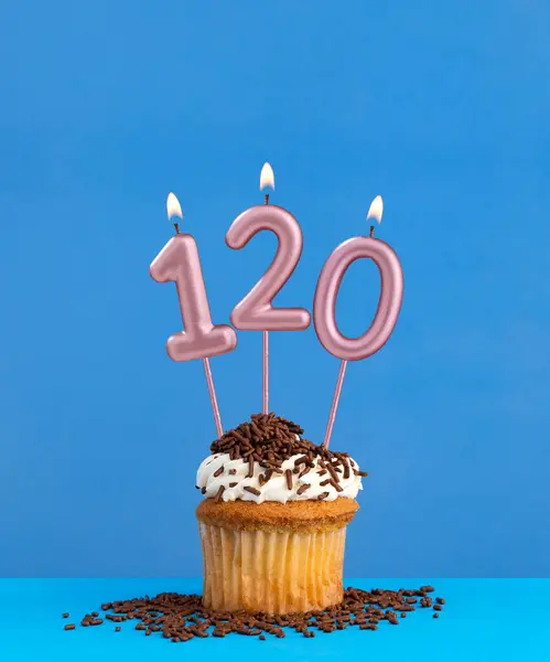 Stock image Candle number 120 - Birthday card with cupcake on blue background