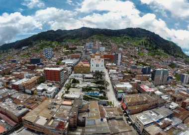 Yarumal, Antioquia. Colombia - June 22, 2024. Aerial panorama made with a drone of the municipality of Yarumal clipart