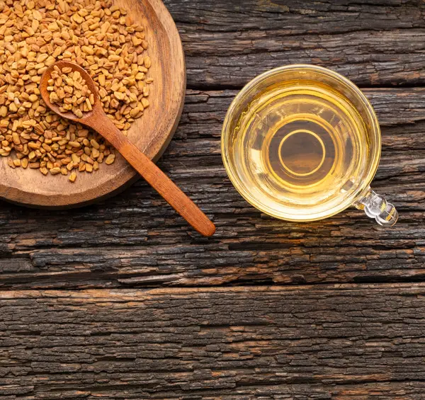 stock image Infusion of aromatic fenugreek seeds - Trigonella foenum - graecum