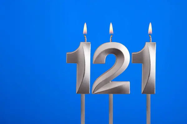 stock image Birthday candle number 121 - Celebration card on blue background