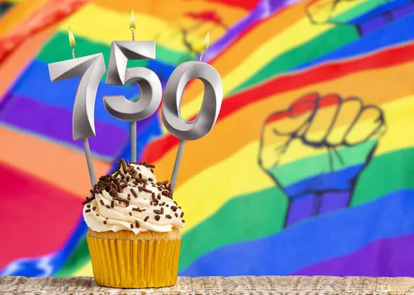 stock image Birthday candle number 750 - Gay march flag background