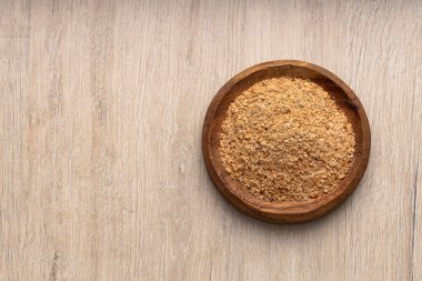 Soya lifine dayalı toz yiyecek kasesi - ahşap arka plan