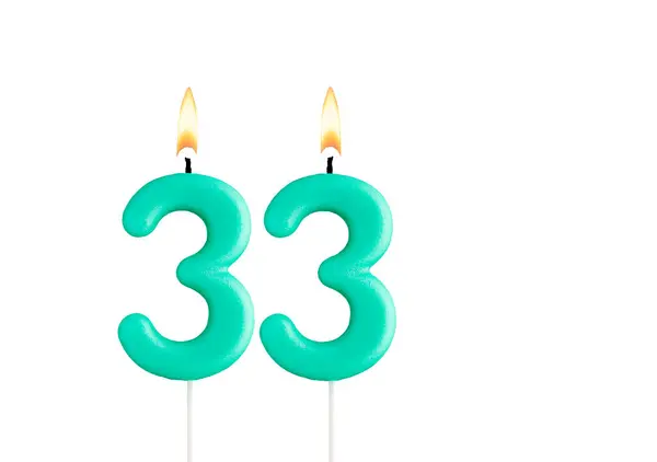 stock image Green birthday candle on white background - Candle number 33